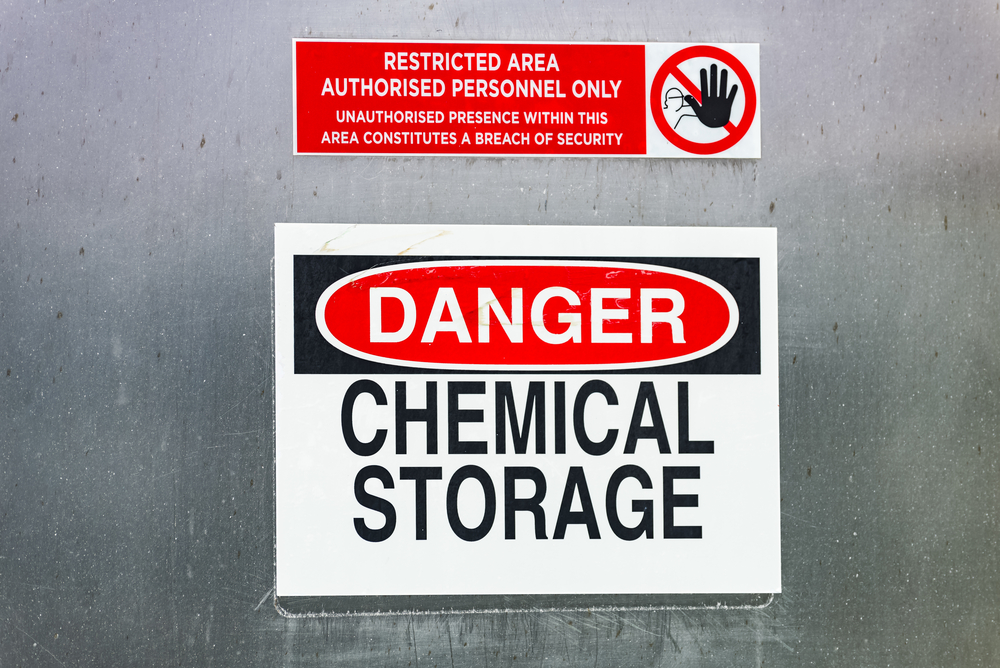 Danger warning sign for chemical storage in restricted area