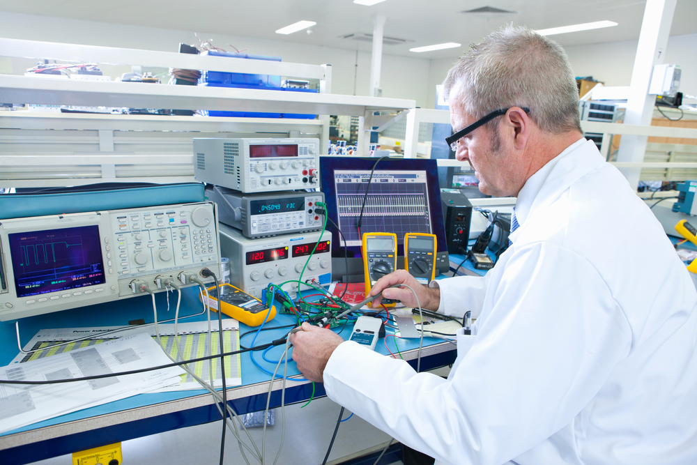 Engineer working at the electrical test bench