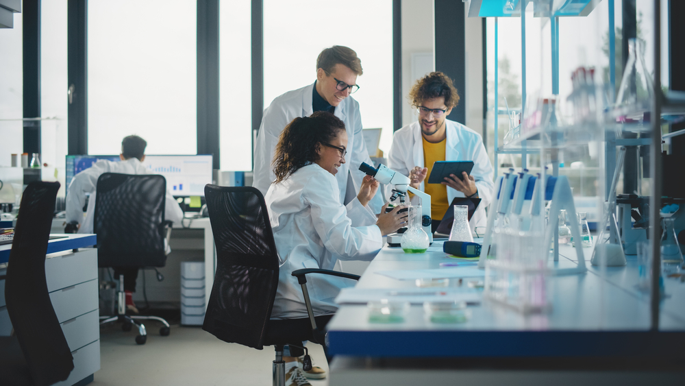 Young Scientists in pharmaceutical lab with ergonomic chairs